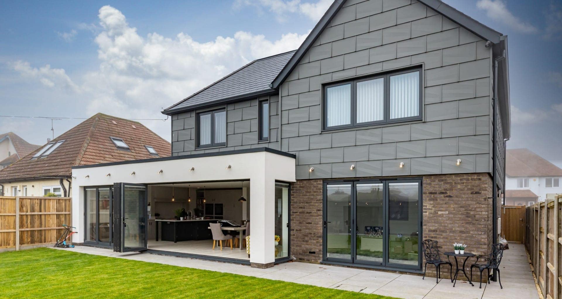 A modern home with a patio and garden area.